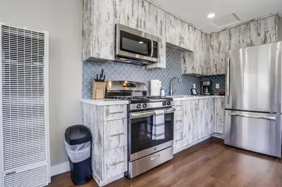 a kitchen with a stove and a refrigerator at Bayside Bikini 2 in San Diego
