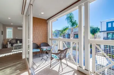 a balcony with a view of a living room at Bayside Cove 4 in San Diego
