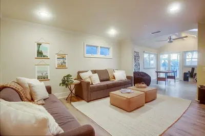 a living room with a couch and a table at Grandview 2 in Encinitas