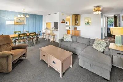 a living room with a couch and a table at North Coast Village in Oceanside