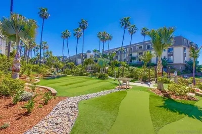 an image of a resort yard with palm trees at North Coast Village in Oceanside