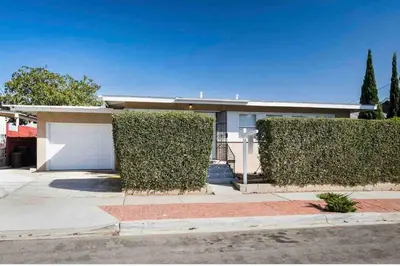 a house with two bushes in front of it at Canyon View Cutie in San Diego