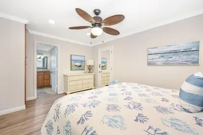 a bedroom with a bed and a ceiling fan at Giant 7 Bedroom Home with 3 separate Condos in Newport Beach
