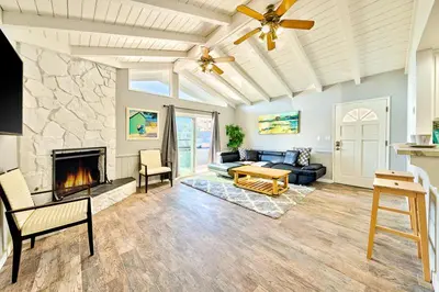 a living room with a couch and a fireplace at Perfect 3 Bedroom Home between the Bay and Beach in Newport Beach
