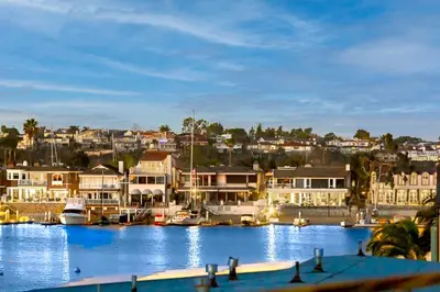 a marina with boats in the water and houses at 2 Story Home with Rooftop Deck next to the Bay & Beach in Newport Beach