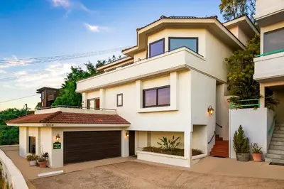a white house with a garage at Spacious Beautiful Home with Stunning Bay Views in San Diego
