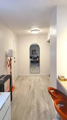 a living room with a painting on the wall at Right In The Heart Of Pacific Beach in San Diego