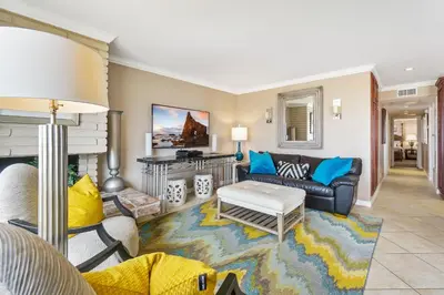 a living room with a couch and a table at 3 Bedroom Home in Balboa - Walk to Pier & Restaurants in Newport Beach