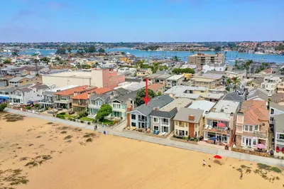 an aerial view of a city with a beach and buildings at 2 Bedroom Home on the Beach with Ocean View in Newport Beach