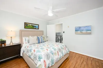 a bedroom with a bed and a ceiling fan at 2 Bedroom Oceanfront with Patio on the Boardwalk in Newport Beach