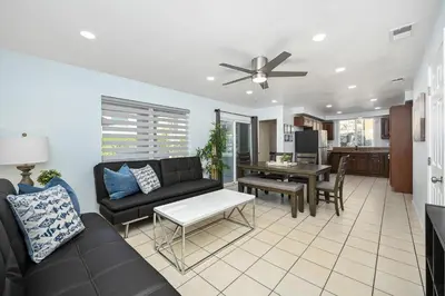 a living room with a couch and a table at Giant Home Sleep 20, Perfect for Multi Family Vacation steps from the Sand in Newport Beach