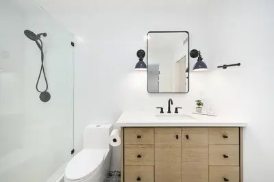 a bathroom with a sink and a mirror at 3 Bedroom Renovated Condo on Balboa Island in Newport Beach