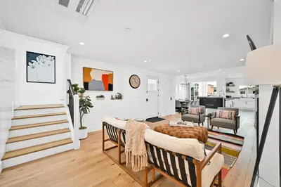 a living room with a couch and a table at 4 Bedrooms in BRAND NEW Luxury built Home walk to the beach in Newport Beach