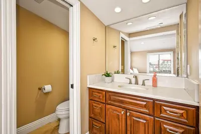 a bathroom with a sink and a toilet at 50 Steps to the Sand on 39th St - Newport Beach in Newport Beach