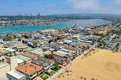 an aerial view of a city next to a beach at 2 Homes Rented Together on the Oceanfront in Newport Beach