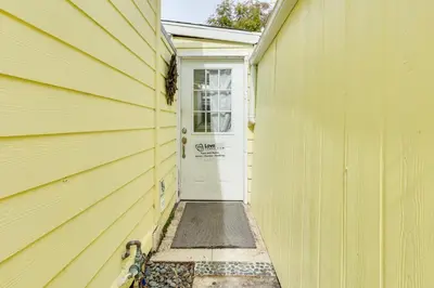 a yellow house with a yellow door and a white door at Carlsbad Bungalow Patio, Hot Tub, Close to Beach! in Carlsbad