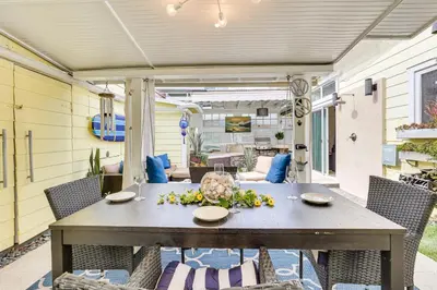 a table and chairs on a patio at Carlsbad Bungalow Patio, Hot Tub, Close to Beach! in Carlsbad