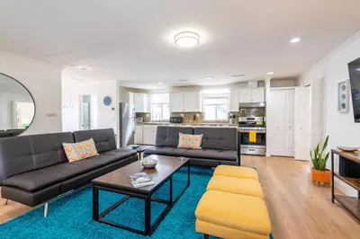 a living room with a couch and a table at CBS-1236 - Sensational Summit Sunsets in Cardiff-by-the-Sea