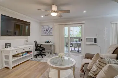 a living room with a couch and a table at 3 Mi to La Jolla Shores Relaxing Resort Retreat! in San Diego