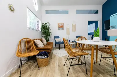 a living room with a couch and chairs and a table at Stylish Casita min from the beach ! in San Juan Capistrano