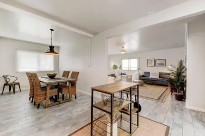 a dining room and living room with a table and chairs at Perla D'Italia -1BR- FREE Driveway Parking -1 Car in San Diego