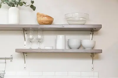 a shelf with bowls and glasses on a wall at Perla D'Italia -1BR- FREE Driveway Parking -1 Car in San Diego