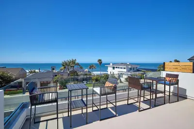 a balcony with chairs and a view of the ocean at Family Beach house in Carlsbad