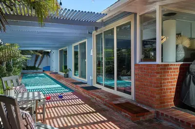 a house with a swimming pool on a patio at Family Beach house in Carlsbad