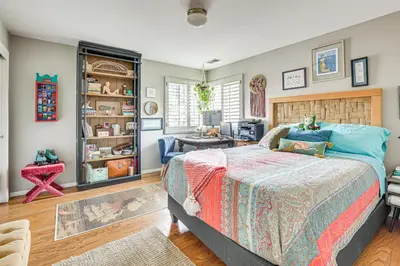 a bedroom with a bed and a desk at Escondido Home Private Pool, 2 Grills and Fire Pit! in Escondido
