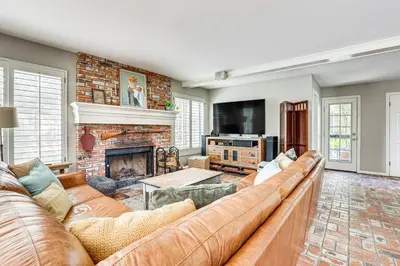 a living room with a couch and a fireplace at Escondido Home Private Pool, 2 Grills and Fire Pit! in Escondido