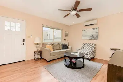 a living room with a couch and a ceiling fan at Casa Amore -2BR- FREE Driveway parking for 3 cars in San Diego