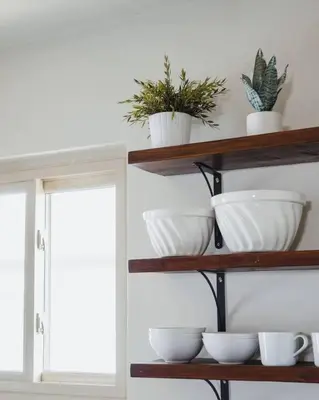 a shelf with bowls and potted plants on it at Casa Italia -2BR- FREE Driveway parking for 2 cars in San Diego