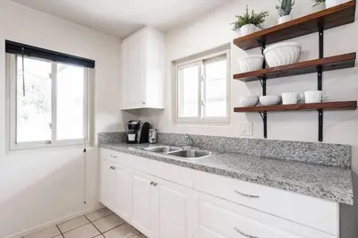 a kitchen with white cabinets and a sink at Casa Italia -2BR- FREE Driveway parking for 2 cars in San Diego