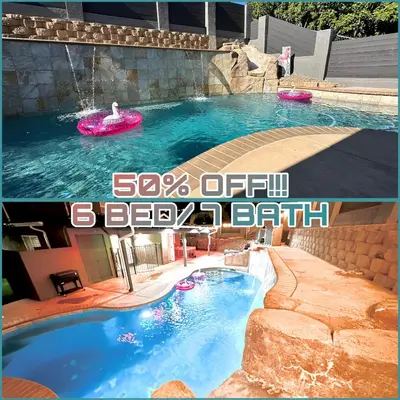 a large swimming pool with a pink frisbee in the water at Luxury Resort•POOL/SPA/Golf/Grill/Games/Sleep 40+ in Lakeside