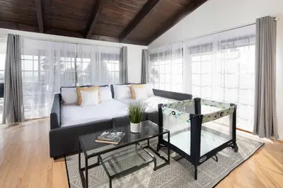 a living room with a couch and a table at 4 Bedroom 2 Bath with Ocean View Hot Tub Parking in San Diego