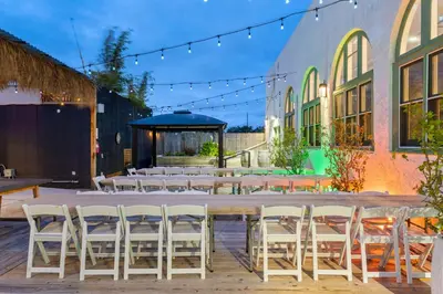 a patio with tables and chairs and a gazebo at Good Life Resorts in San Diego