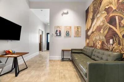 a living room with a couch and a flat screen tv at Good Life Resorts in San Diego