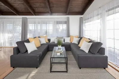 a living room with a couch and a table at 3 Bedroom with Ocean View Jacuzzi and Parking in San Diego