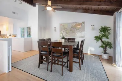 a dining room with a table and chairs at 3 Bedroom with Ocean View Jacuzzi and Parking in San Diego