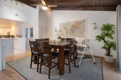 a kitchen and dining room with a table and chairs at 3 Bedroom with Ocean View Jacuzzi and Parking in San Diego