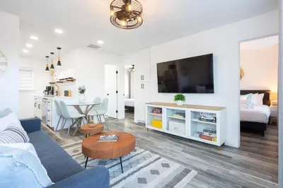 a living room with a couch and a table at 2 Bedroom House - Fire Pit Table BBQ - Downtown in San Diego