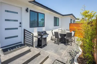 a patio with a grill and a table and chairs at 2 Bedroom House - Fire Pit Table BBQ - Downtown in San Diego