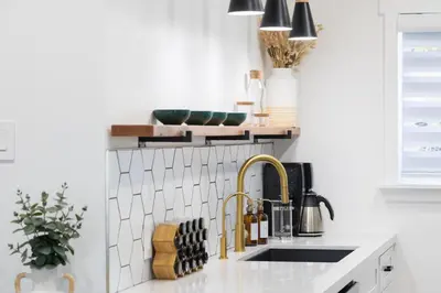 a kitchen with a sink and a faucet at 3 Bed House with Fire Pit Table and BBQ - Downtown in San Diego