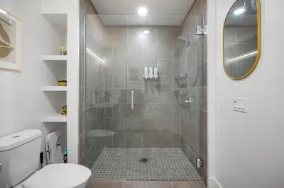 a bathroom with a shower with a glass door at Park Lux PlayHouse in San Diego