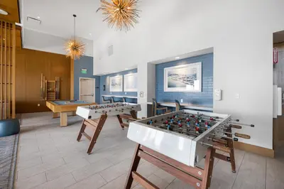 a living room with two foosball tables and ping pong balls at Park Lux PlayHouse in San Diego