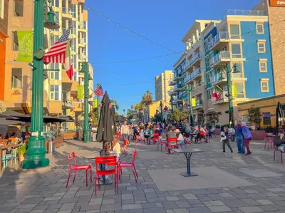 a city street with tables and chairs and buildings at Italyhaus in San Diego