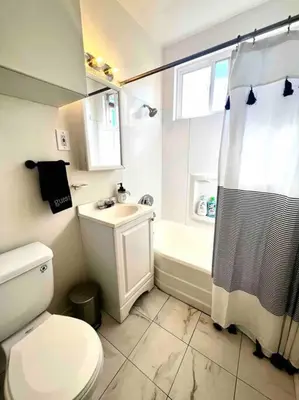 a bathroom with a toilet and a sink and a shower at Minimalist 1 bed by Airport & Old Town in San Diego