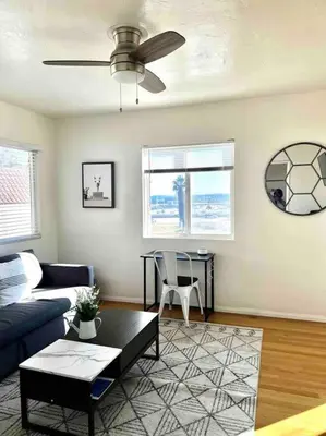 a living room with a couch and a table at Minimalist 1 bed by Airport & Old Town in San Diego