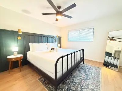 a bedroom with a bed and a ceiling fan at Echo by Coast to Cactus - Family-Friendly Home in La Mesa