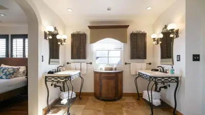 a bathroom with two sinks and a bed at Mediterranean-Style Villa in Point Loma in San Diego